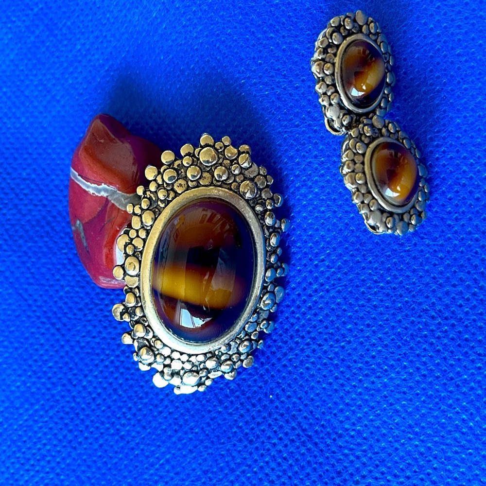 Brooch and screw on earrings.